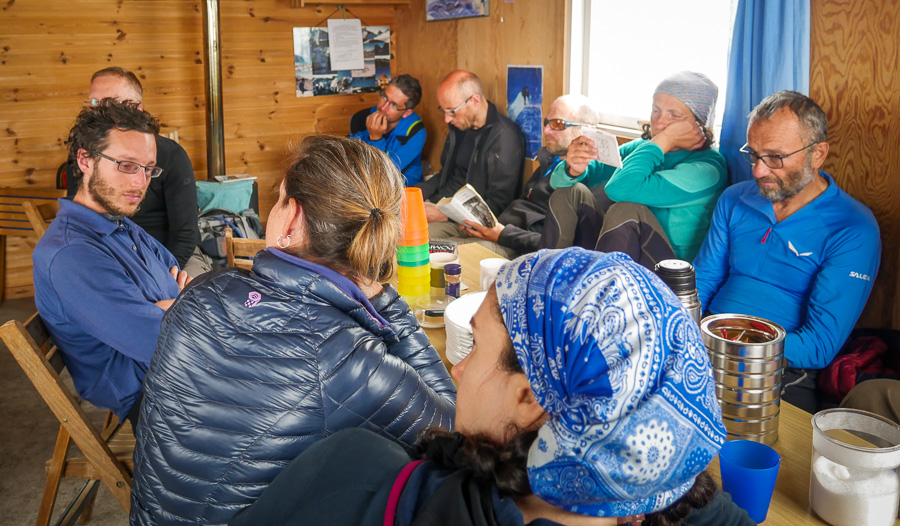 The group hanging out around the dining table at the Tasiilaq Mountain Hut