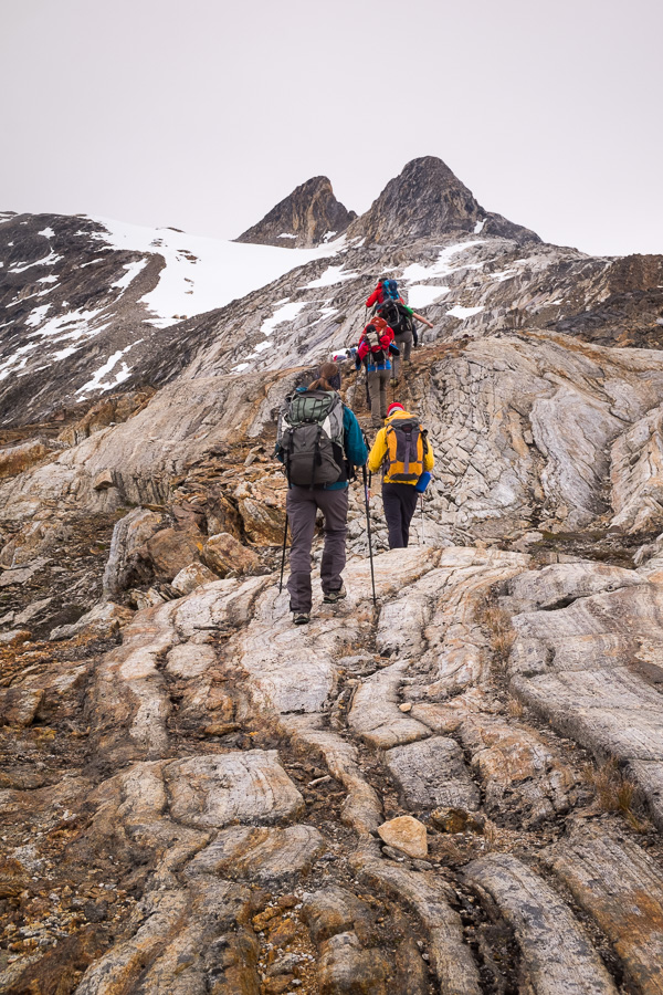 Trekking group making their way up some amazing rock formations