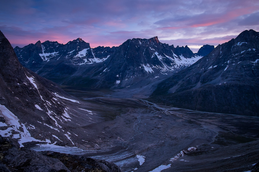 Clouds highlighted in pink as the Sun sets over the Tasiilap Kua valley - as seen from the Tasiilaq Mountain Hut
