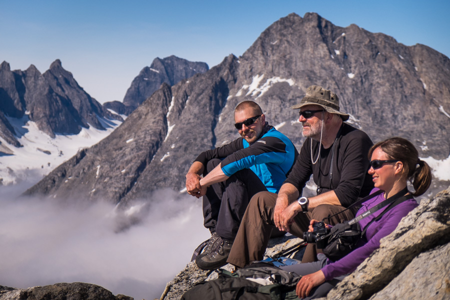 Three of my trekking companions sitting on rocks enjoying the sun and the views