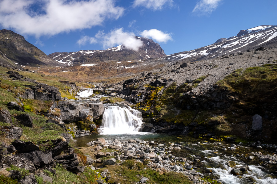 Small waterfall with Kuannersuit mountain in the background. As seen on the Kvanefjeld hike near Narsaq in South Greenland