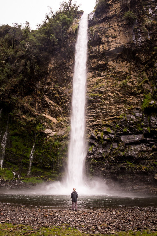 Me standing in front of the impressive Cascada Condor Machay near Quito, Ecuador