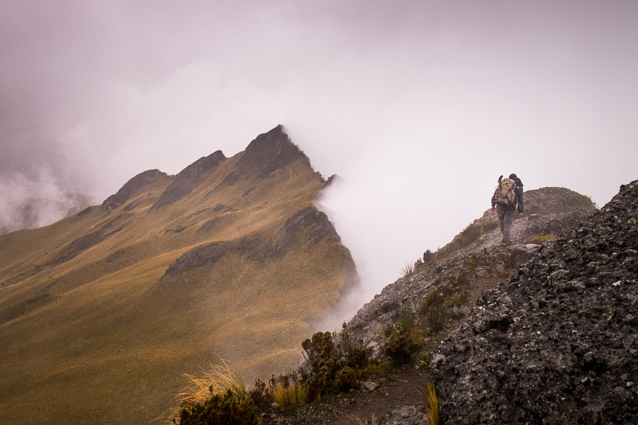 2 of my hiking companions following the ridge lining the fog-filled crater of Volcán Pasochoa near Quito, Ecuador
