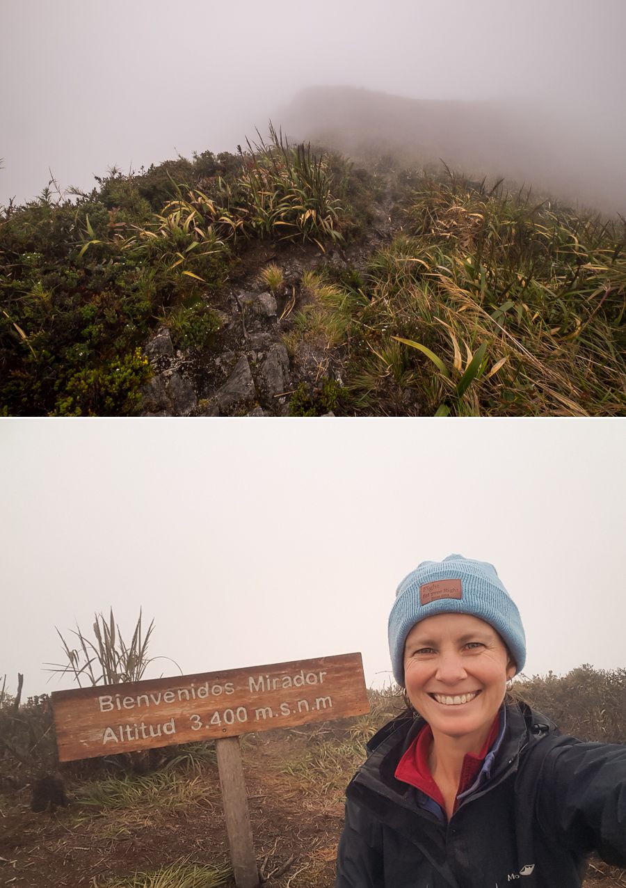 Me at the sign indicating the highest point of Los Miradores hike in Podocarpus National Park near Loja, Ecuador