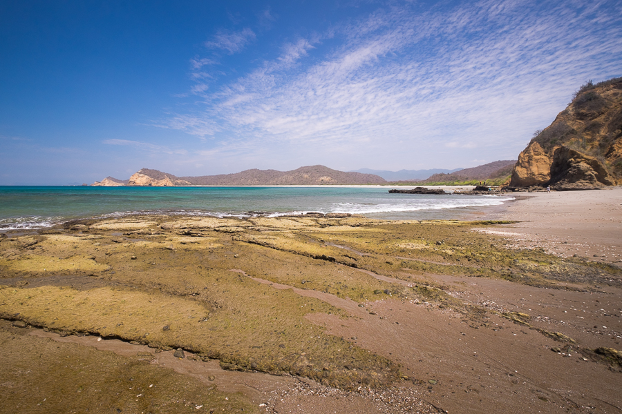 Rocks at the end of Playa Los Frailles, looking back along the horseshoe of the main beach - Ecuador