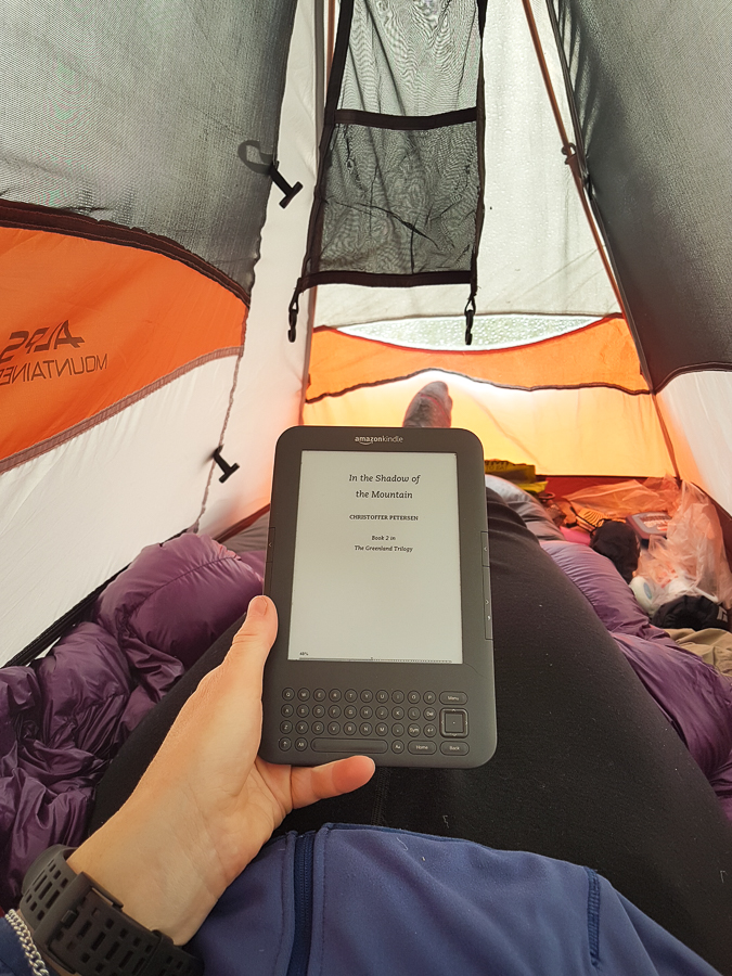 Reading my kindle in my tent