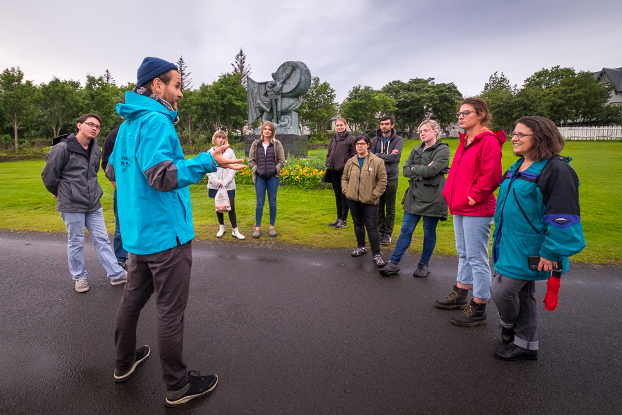 Stefan telling stories near the Úr Álögum statue on the Icelandic Mythical walk by Your Friend in Reykjavik