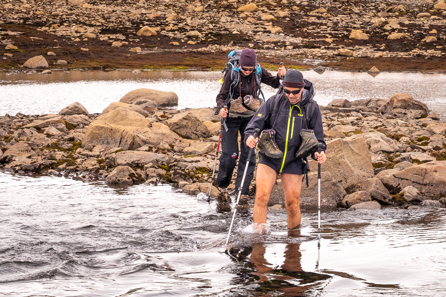 Wading across the river in underwear on Day 2 of Shadow of Vatnajökull trek - East Iceland