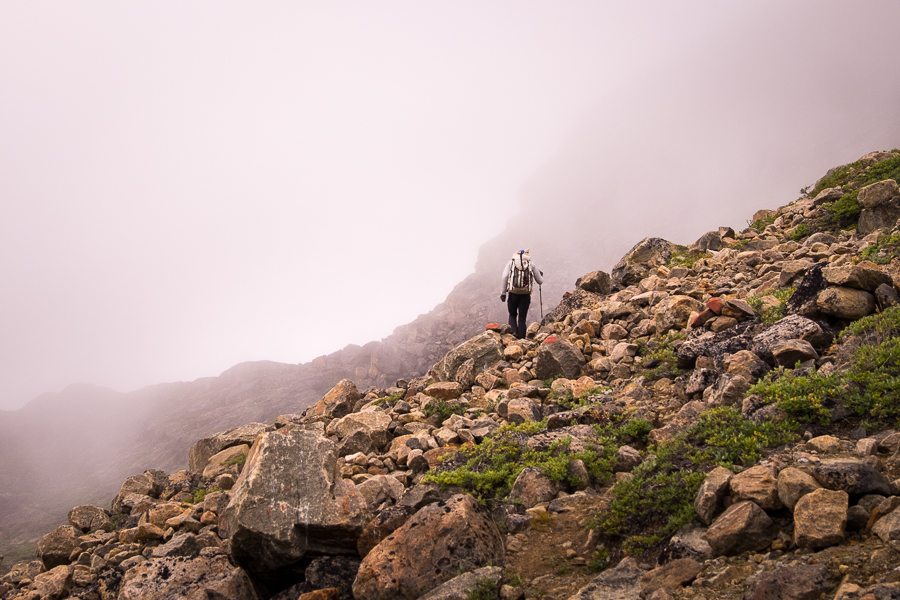 My friend hiking towards a mountain obscured in the fog between Assaqutaq and Sisimiut - West Greenland