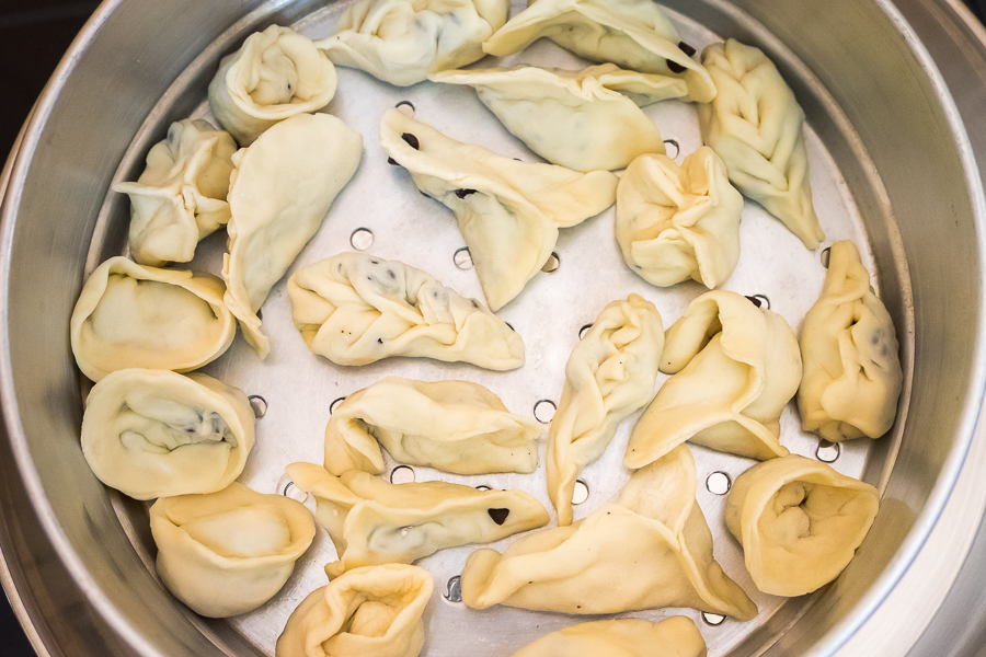 uncooked chocolate momos in steaming pan - 2Sisters Nepal Cooking School - Kathmanu