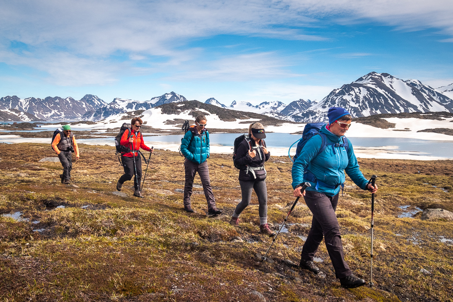 Trekking companions hiking on Kulusuk Island - East Greenland