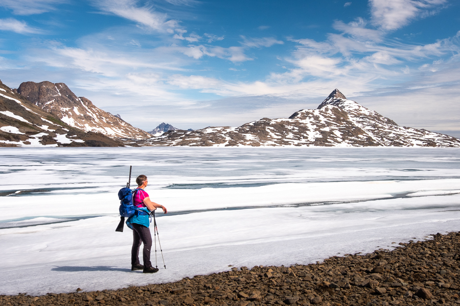Admiring the semi-frozen Lake 168 on the Sermilik Way - Ammassalik Island East Greenland