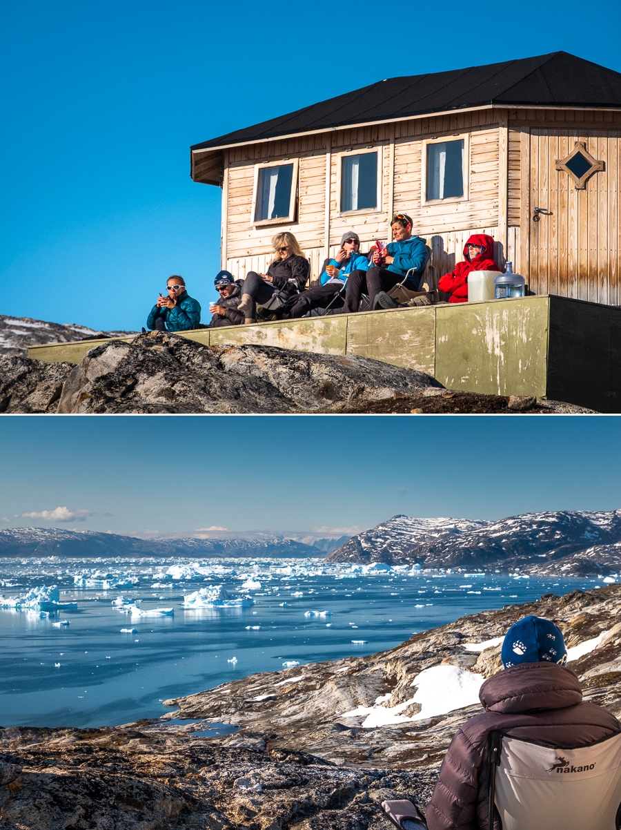 Sitting on porch of hut at Tinit enjoying the sun and afternoon tea - East Greenland