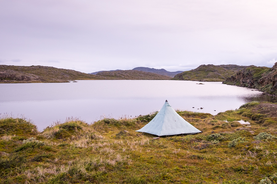 Tyson's tent set up on the lake near Ikkattooq Hut - Arctic Circle Trail - West Greenland