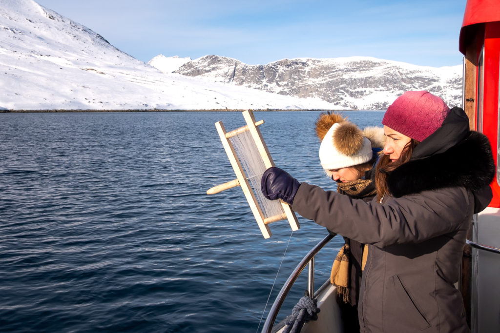 Image of two people fishing - Nuuk Fjord Safari, West Greenland