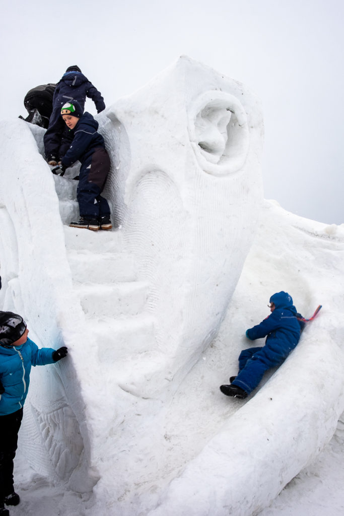 Kids playing on an interactive sculpture at the Nuuk Snow Festival - West Greenland