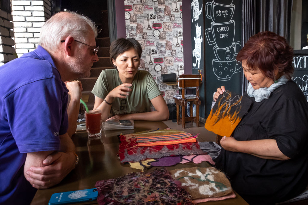 Gulmira displaying her artistic felts as an introduction to the workshop