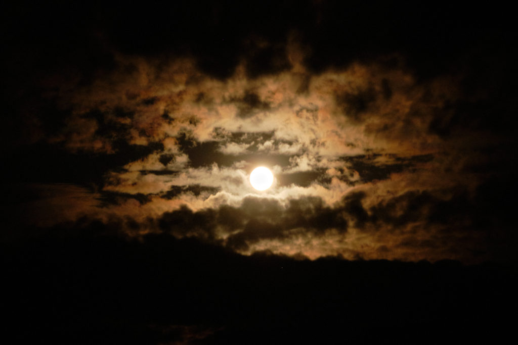 Moonrise surrounded by clouds