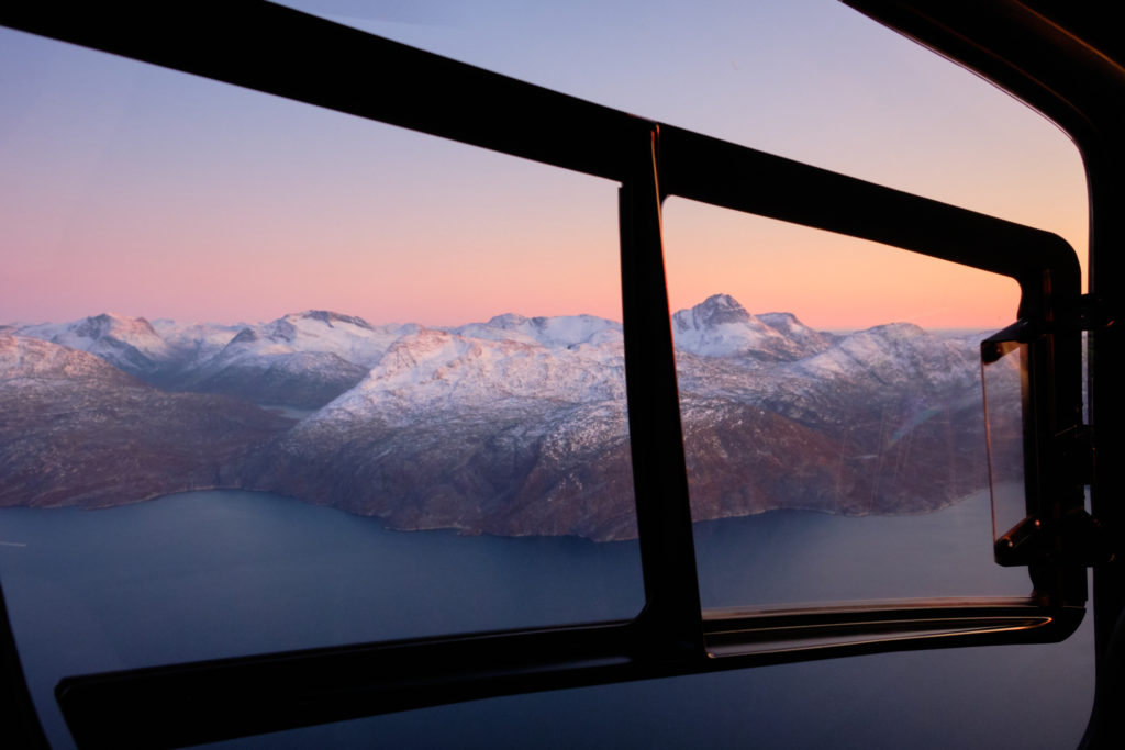 pastel light view looking out the side window of the helicopter summit flight - Nuuk - West Greenland