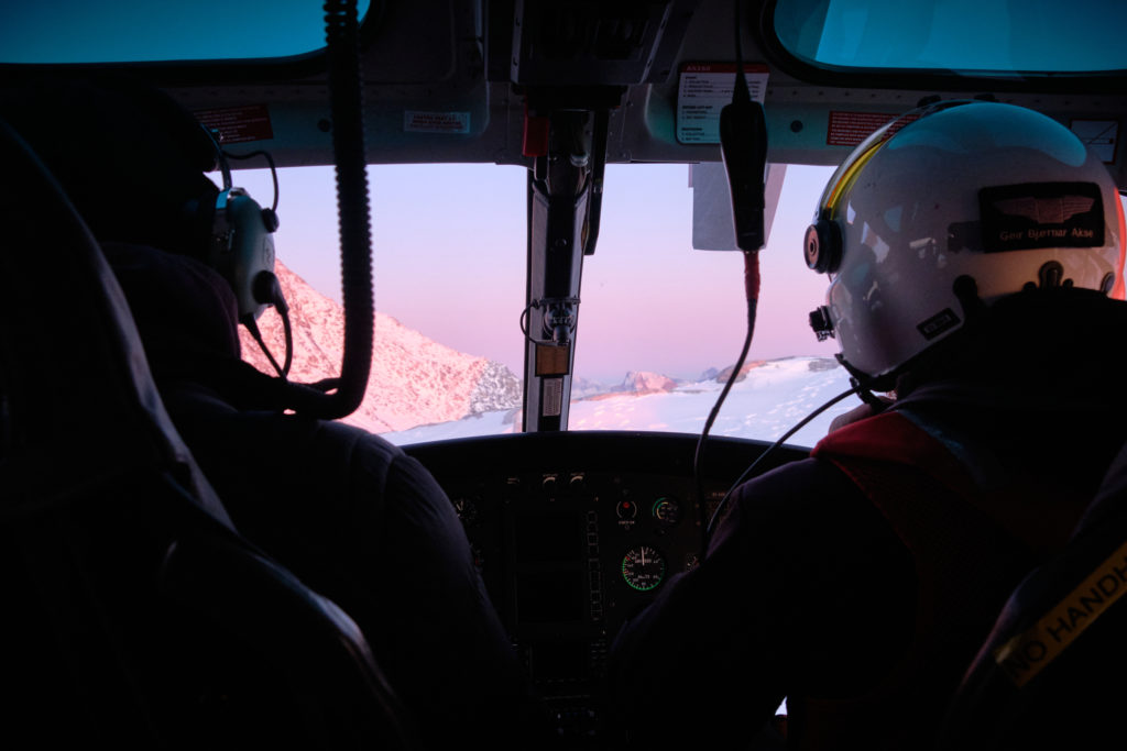 looking out the front window between the pilot and passenger on Nuuk helicopter summit flight - West Greenland