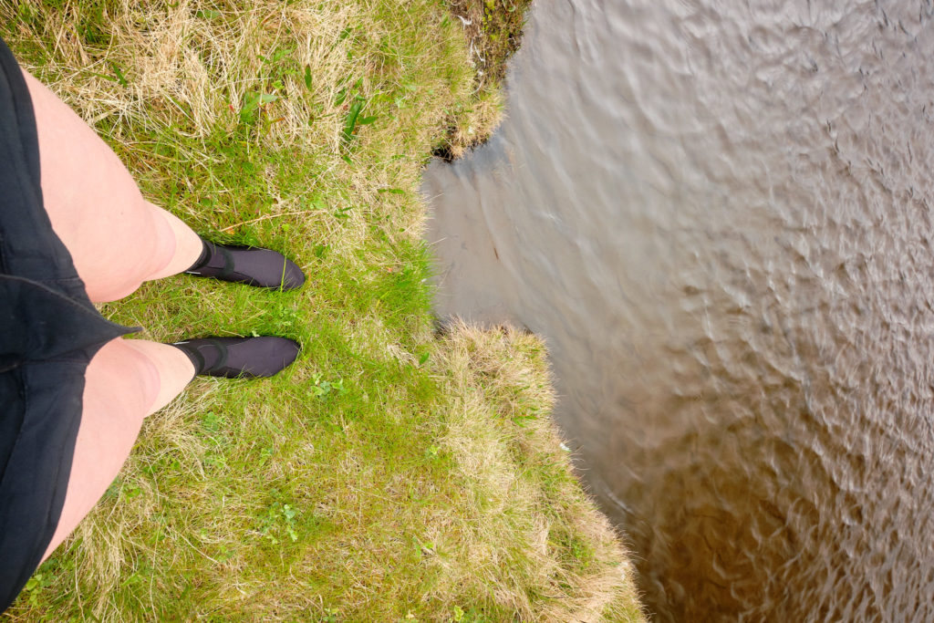 Preparing for river crossing near Horvik  with neoprene socks - Hornstrandir -Iceland