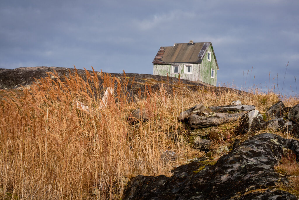 Graveyard and house in the abandoned settlement of Kangeq near Nuuk-Greenland
