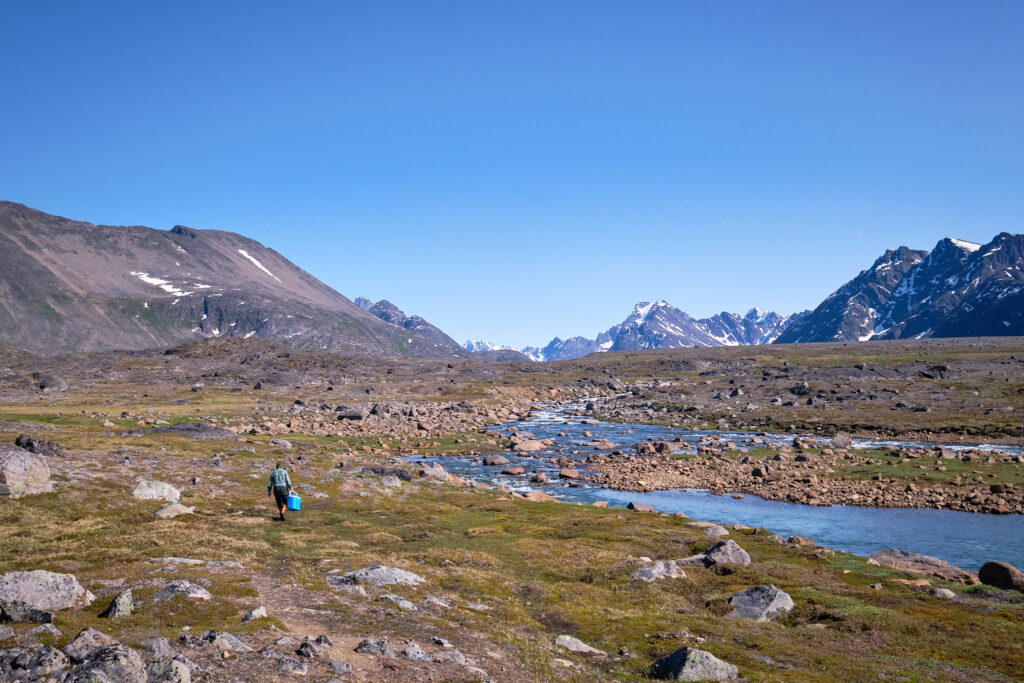 walking beside river to go arctic char fishing at Sassannguit near Sisimiut - Greenland