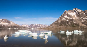 Blue skies finally and views of icebergs in the fjord from our campsite