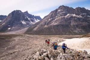 My trekking companions hiking up the glacial morraine on the way to Tasiilaq Mountain Hut with the Tasiilap Kua Valley below