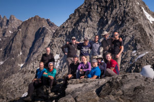 My 12 trekking companions posing for the group photo at the summit