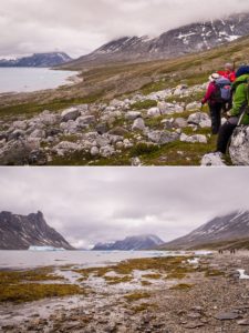 Trekking companions hiking along the shores of the Sermiligaaq Fjord