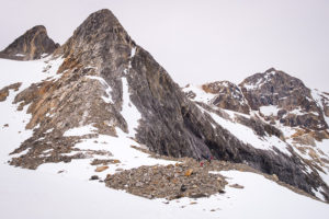 The patch of bare rocky ground on which we had lunch, with the mountains towering above us