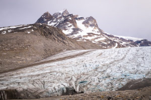 Looking up the steep slope of the unknown glacier towards the mountains behind