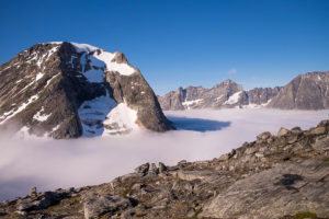 The Tasilap Kua Valley (as seen from above) is filled with thick cloud. Only the mountain peaks above the cloudbank are visible