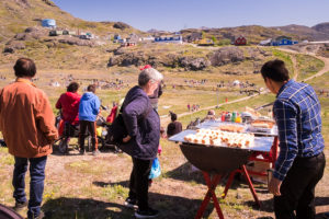 Narsaq locals enjoying a sausage sizzle for Greenland National Day