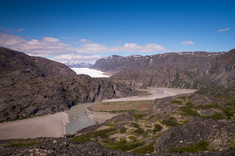 The river leading from the Glacier and the Glacier itself in background as seen from the viewpoint of the Ridge Hike near Narsarsuaq, South Greenland