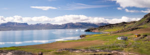 View of the fjord, Sillisit Hostel and green grass in South Greenland