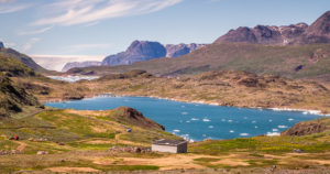 Nunataaq farm with the Southern Sermalik Fjord and the Greenland Ice Sheet in the background, South Greenland