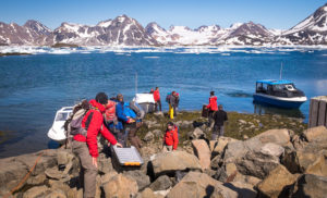 Loading the speedboats in Kulusuk Harbour at the start of the Unplugged Wilderness Trek in East Greenland