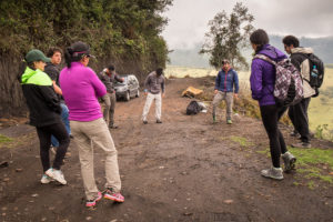 Hiking companions warming up before starting along the trail to Volcán Pasochoa near Quito, Ecuador