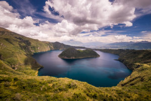 Wide view of Teodoro Wolf Island in Laguna Cuicocha while hiking the crater rim near Otavalo, Ecuador