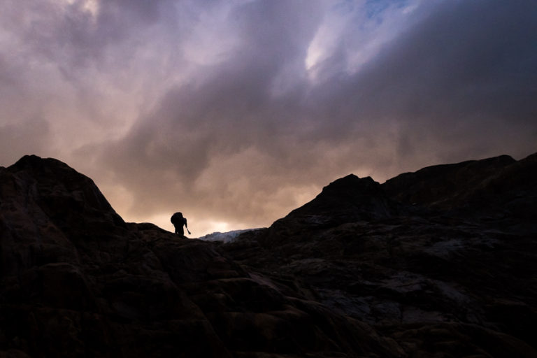 Silhouette of trekking companion climbing toward the glacier - South Patagonia Icefield Expedition - Argentina