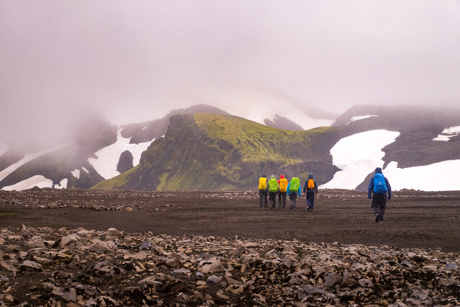 Hiking across black volcanic sand in miserable weather - Volcanic Trails - Central Highlands, Iceland