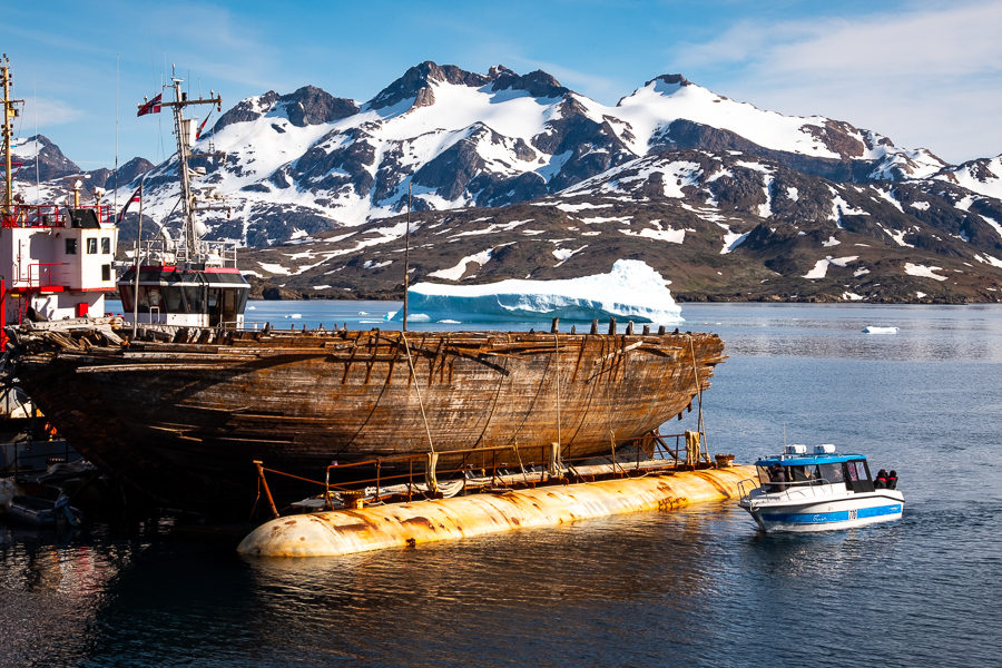 Locals checking out Roald Amundsen's ship "Maud" at Tasiilaq harbor - East Greenland