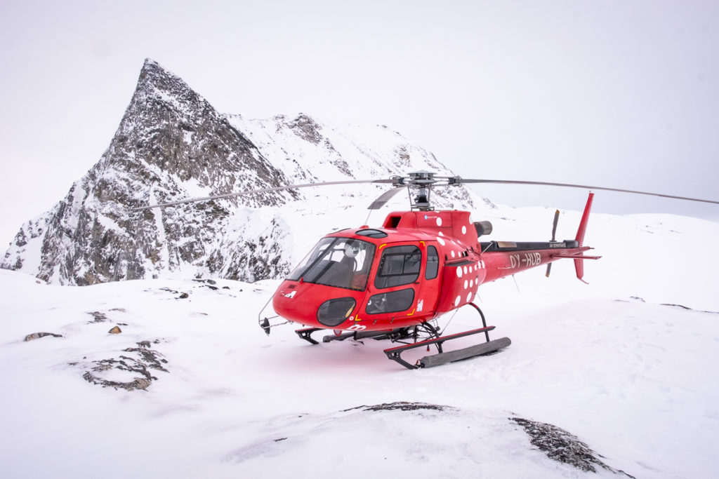 Helicopter landed near the summit of Sermitsiaq mountain near Nuuk, Greenland