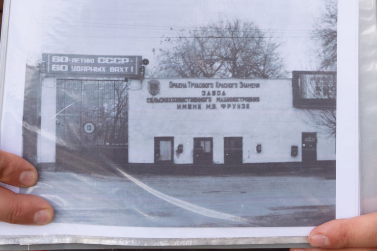 Historical photo of the gate leading into the Interhelpo factories