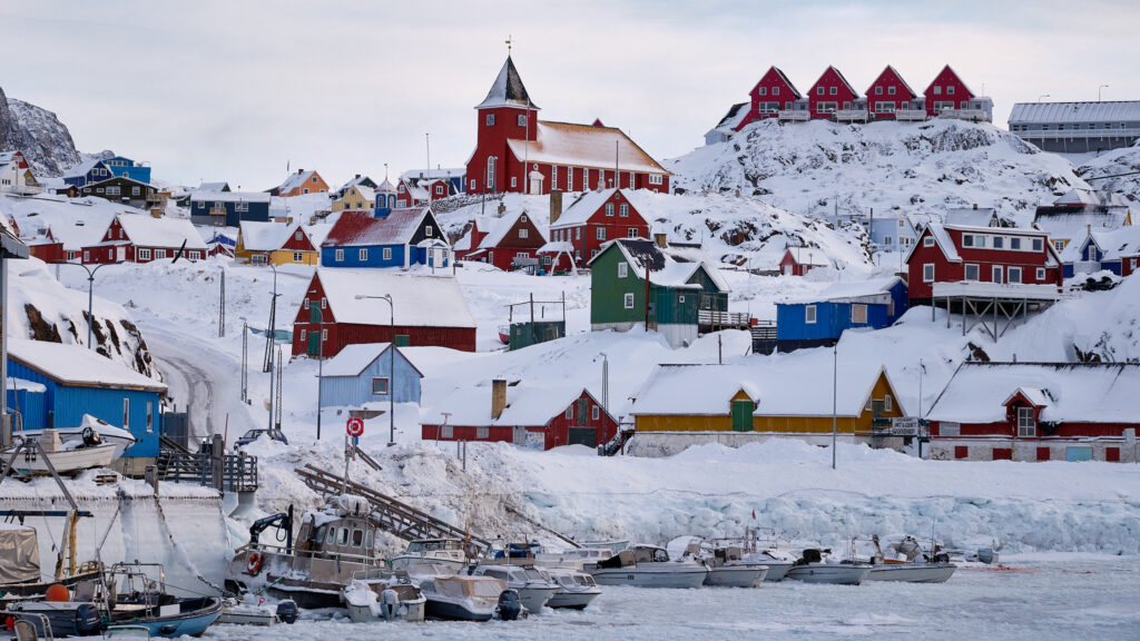 Overview of Sisimiut in West Greenland, showing the town, surrounding mountains, and coastal setting.